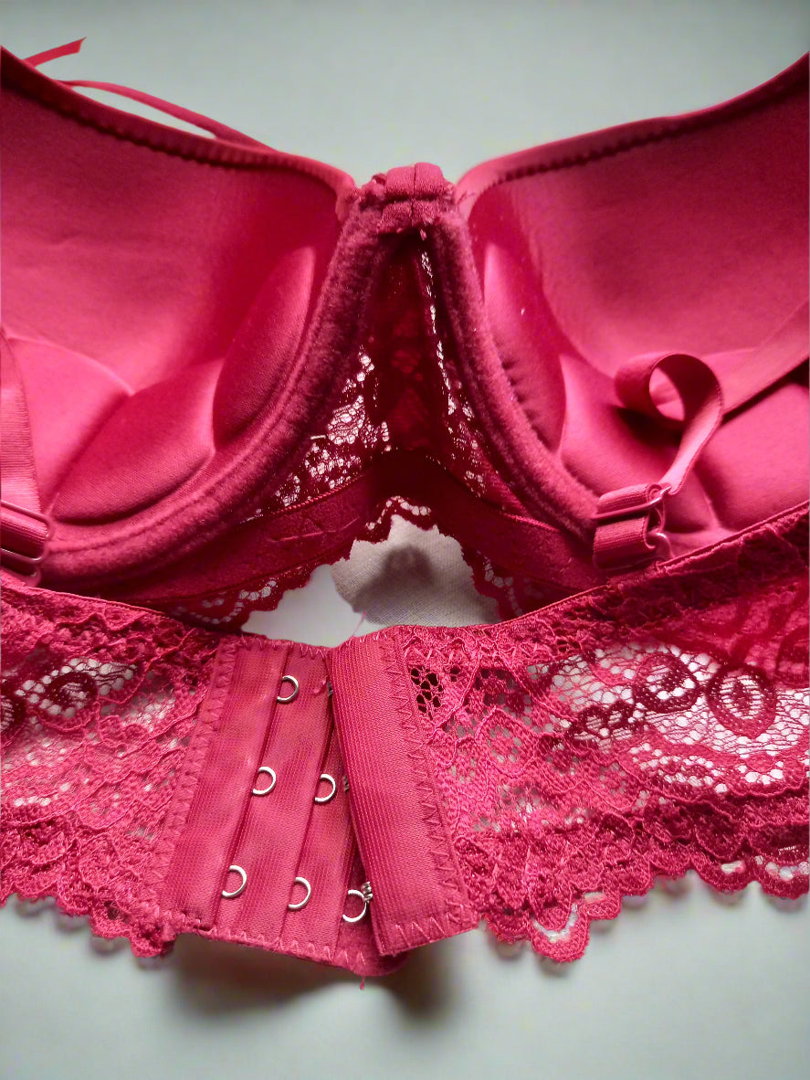 Red lace lingerie set on a white background